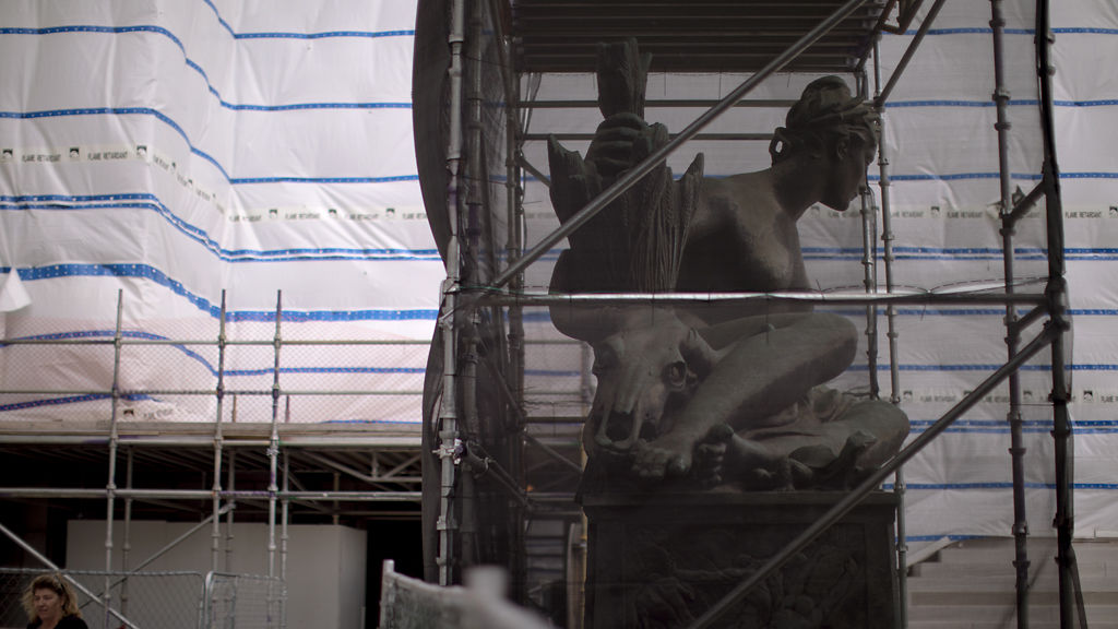 The Mother of Water statue is enclosed to protect it during construction at the Capitol
